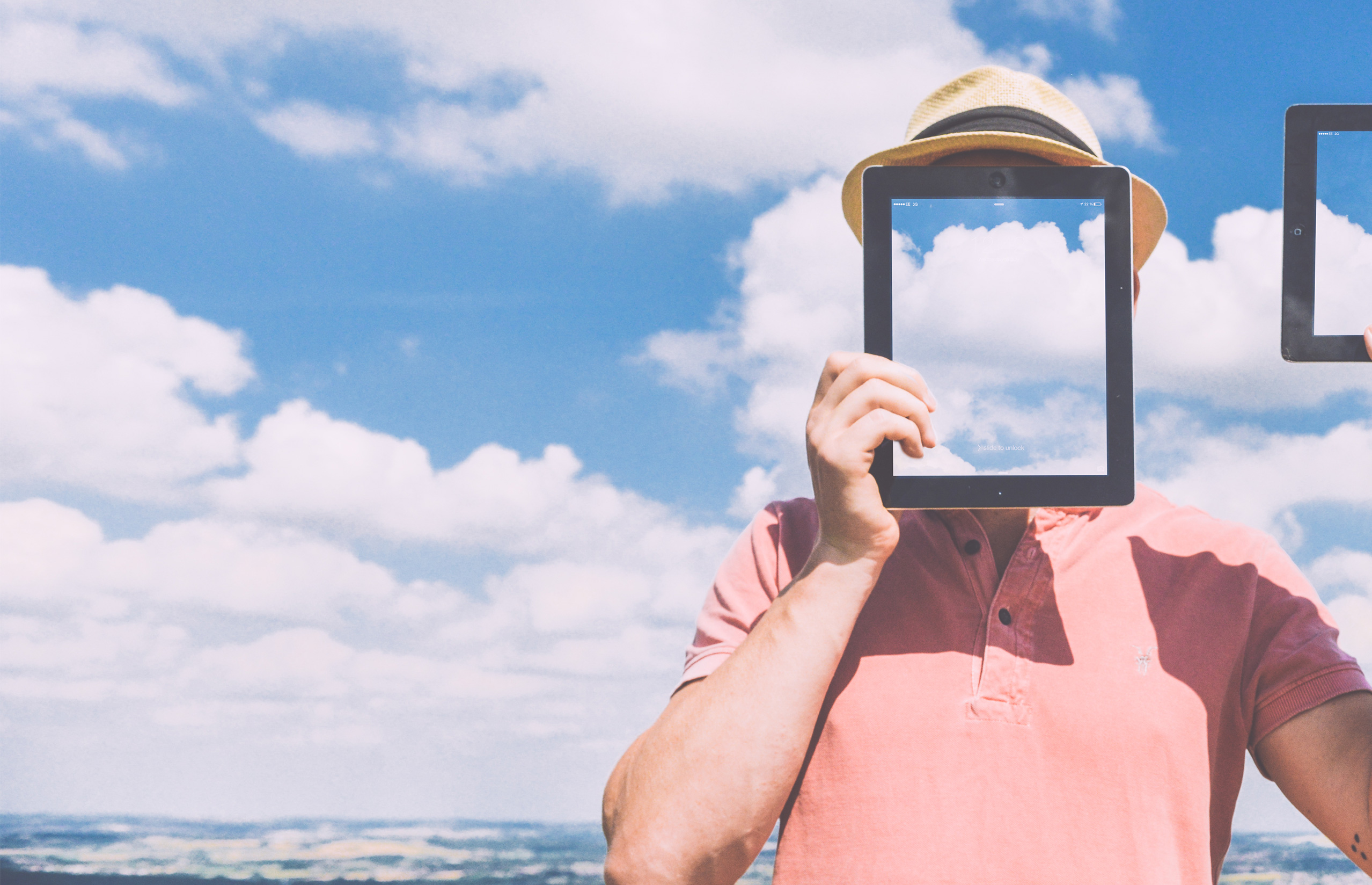 younity is made of dreamers man with ipad in front of his face