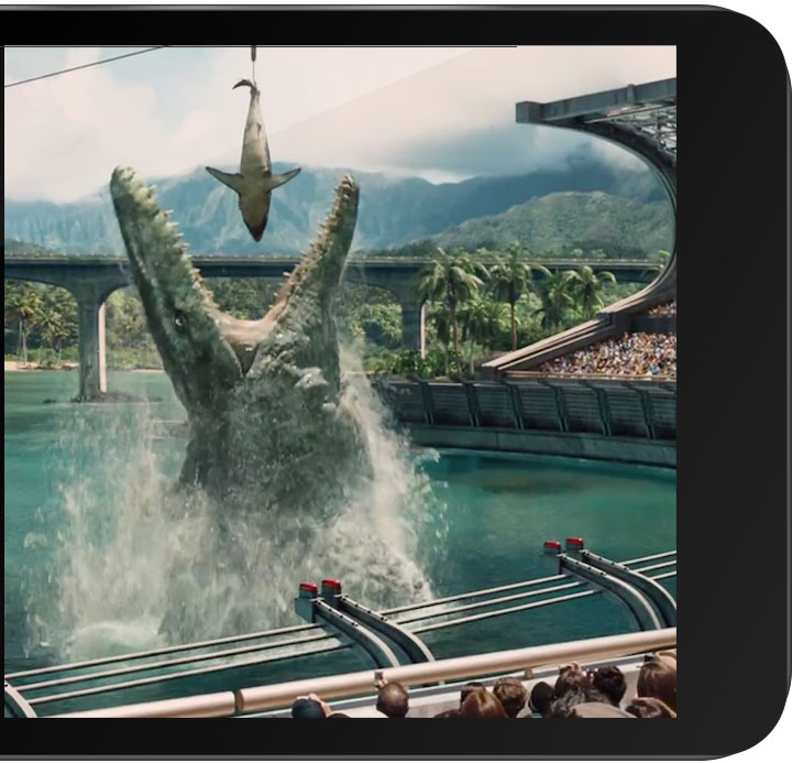 tablet with still from the movie Jurassic World